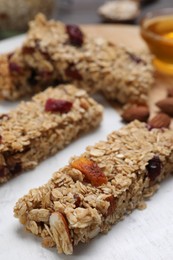Photo of Tasty granola bars on board, closeup view