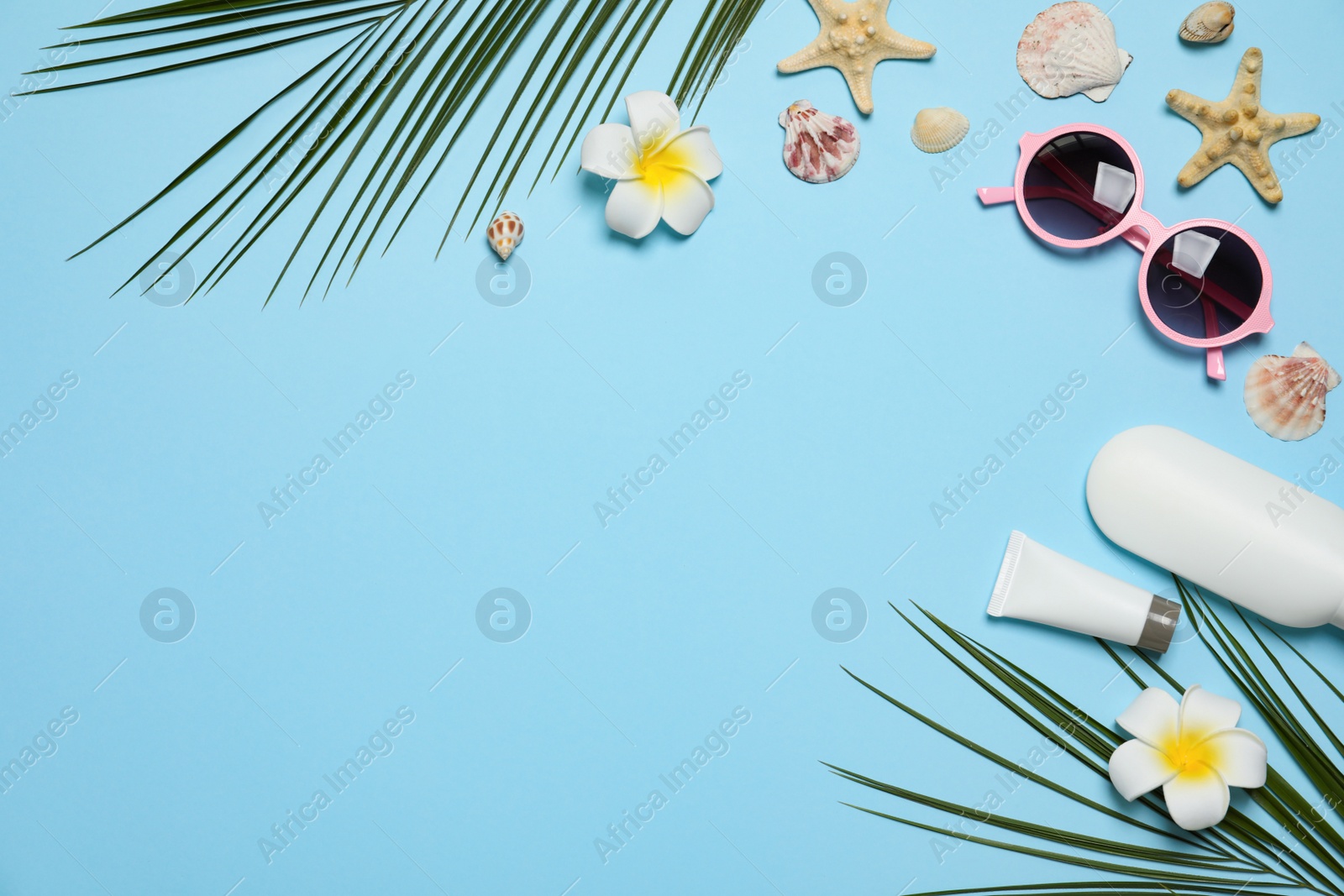 Photo of Flat lay composition with beach accessories on color background, space for text