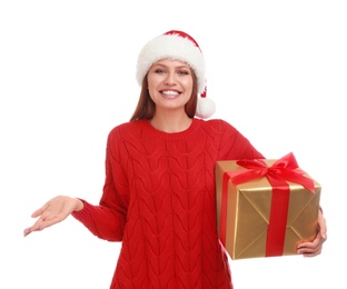 Photo of Happy young woman in Santa hat with Christmas gift on white background