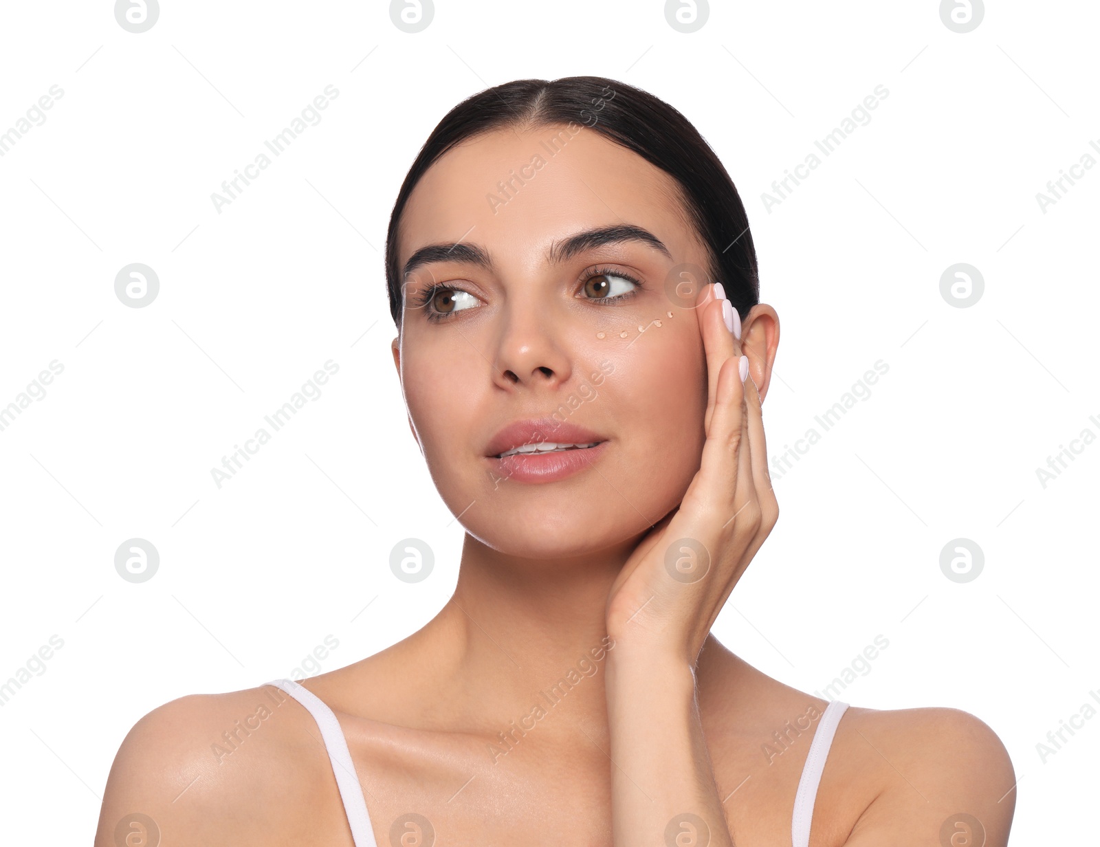 Photo of Beautiful young woman with gel on skin under eye against white background