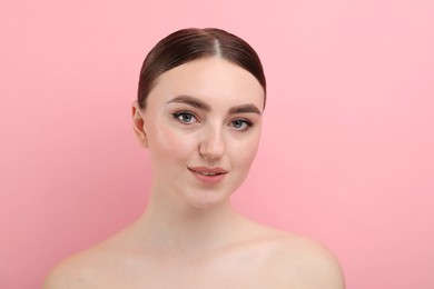 Photo of Makeup product. Woman with black eyeliner and beautiful eyebrows on pink background