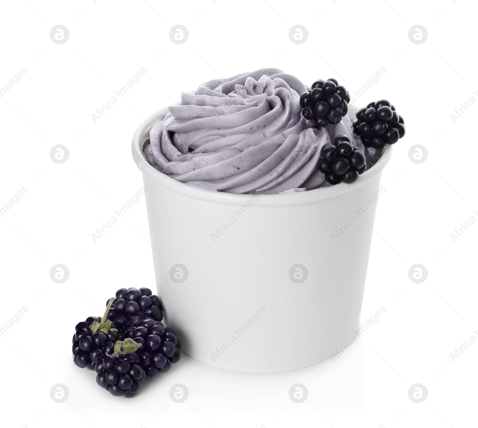 Photo of Cup of tasty frozen yogurt with blackberries on white background