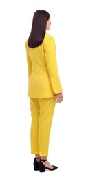 Photo of Businesswoman in yellow suit standing on white background