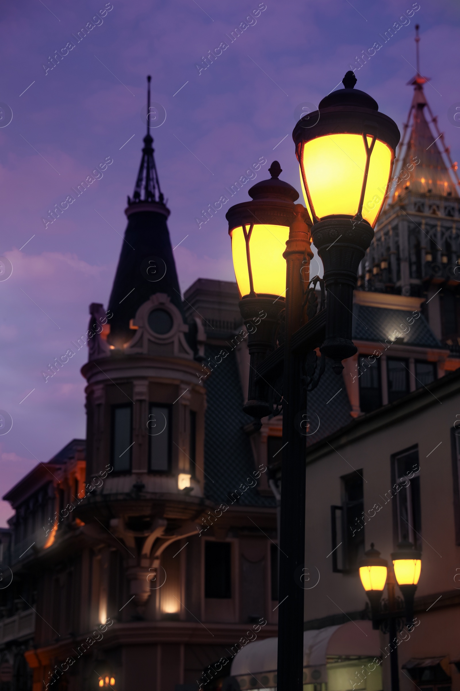 Photo of Beautiful cityscape with glowing streetlights in evening