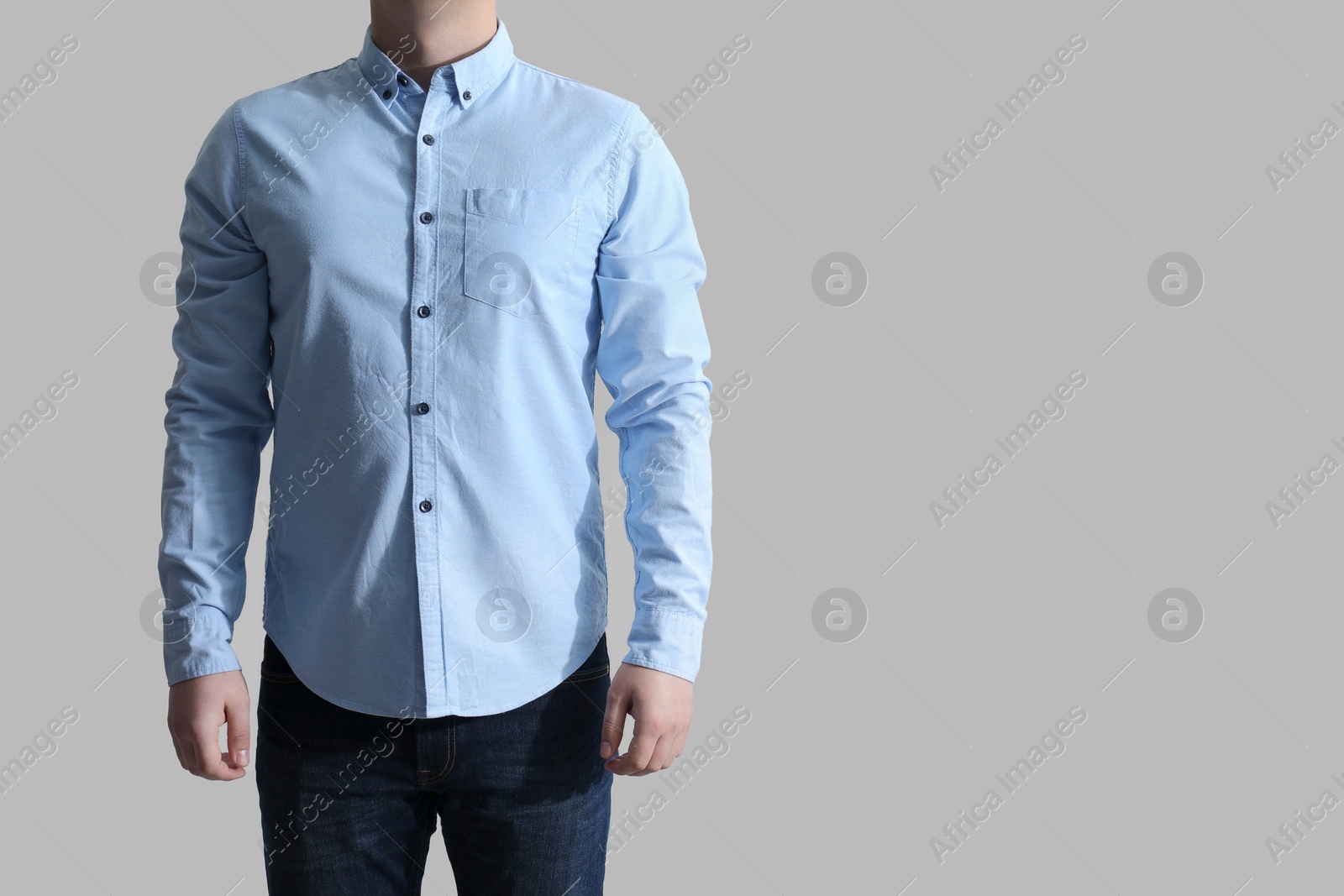 Photo of Man wearing clean shirt on white background, closeup. Space for text