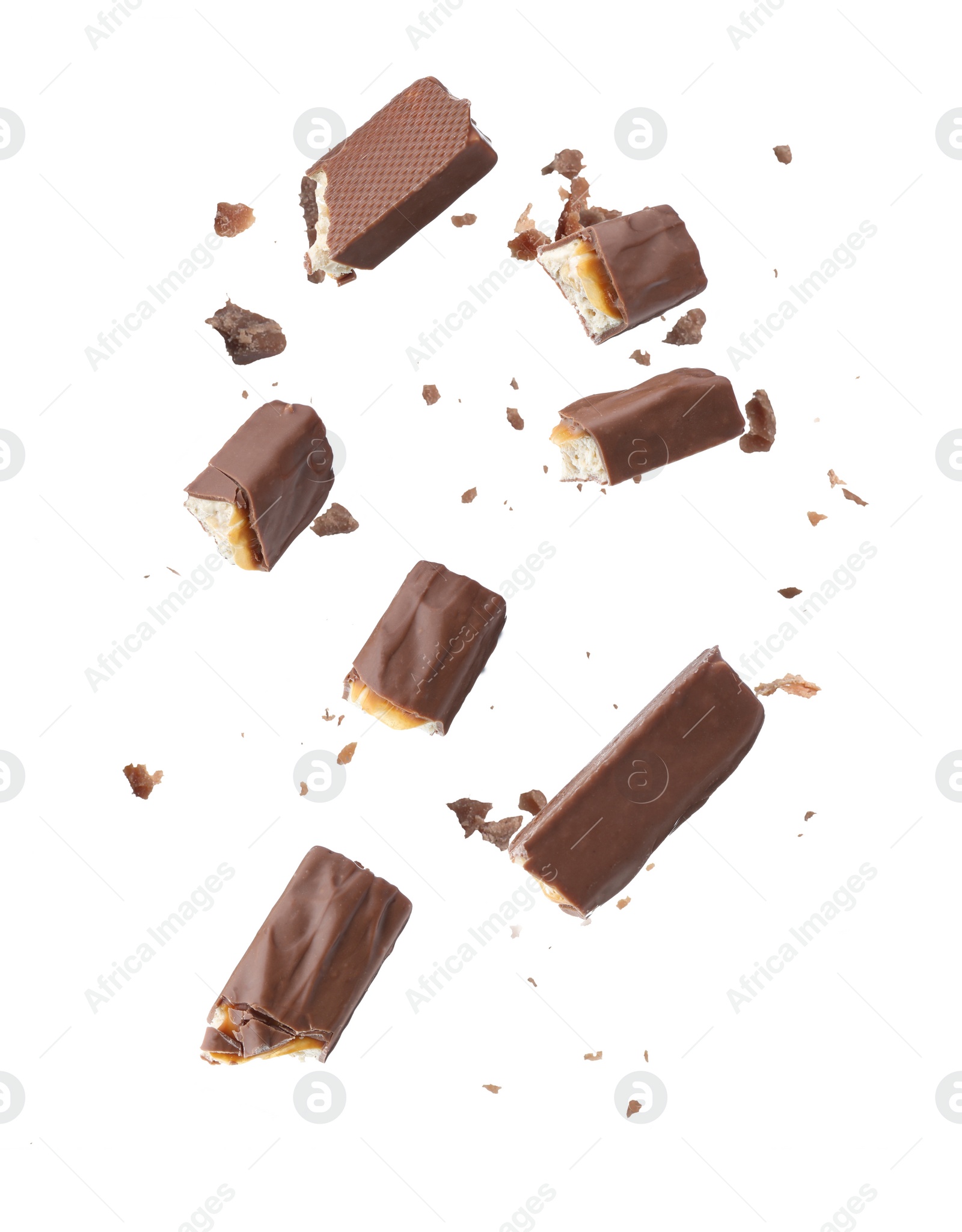 Image of Pieces of chocolate bars falling on white background