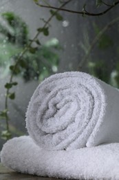 White terry towels on table in bathroom