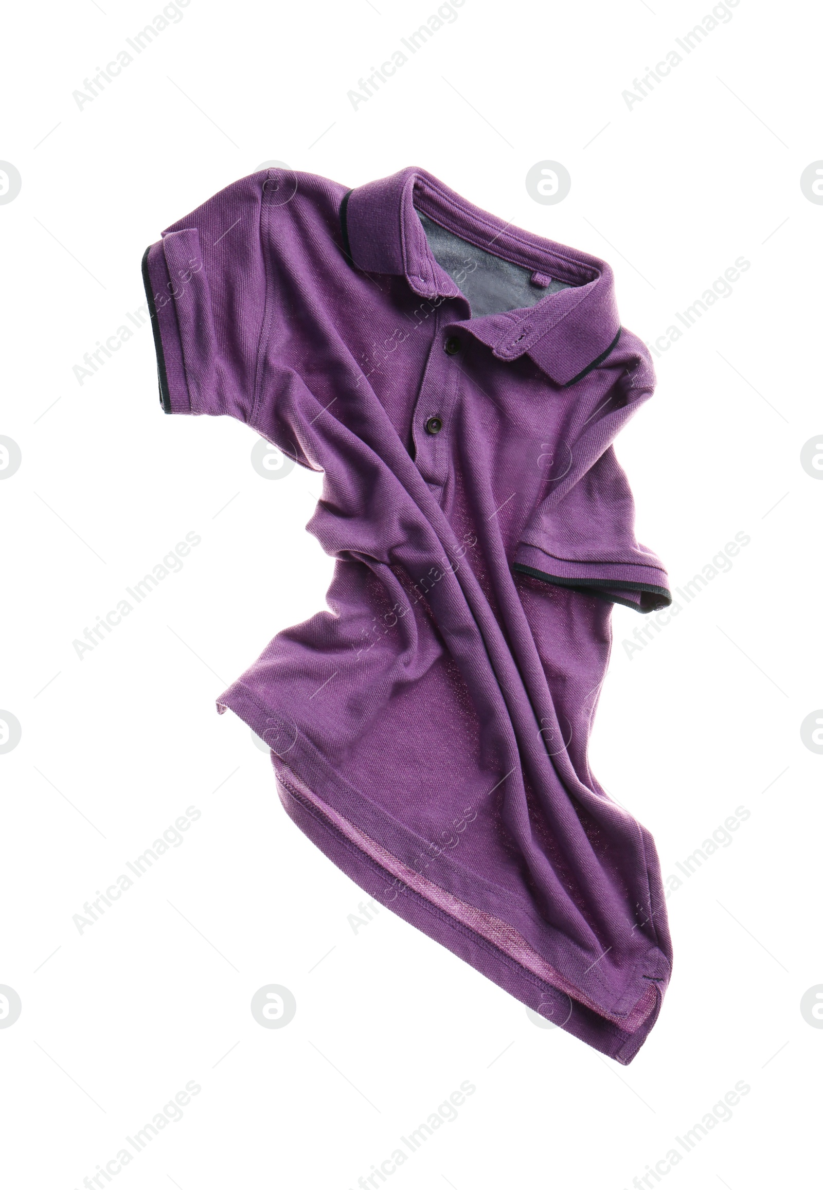 Photo of Rumpled purple shirt isolated on white. Messy clothes