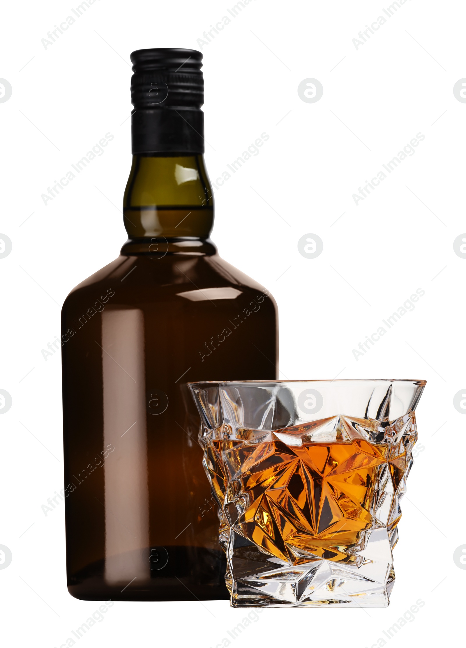 Photo of Glass and bottle of whiskey isolated on white