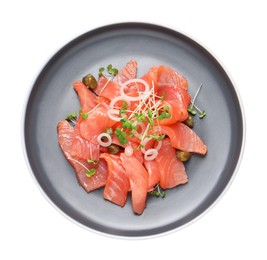 Photo of Salmon carpaccio with capers, onion and microgreens isolated on white, top view
