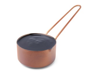 Metal small saucepan with balsamic glaze on white background