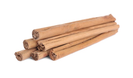Aromatic brown cinnamon sticks on white background