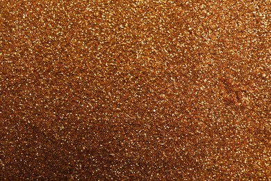 Beautiful shiny bronze glitter as background, closeup