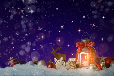 Image of Composition with Christmas lantern on snow, space for text. Magical atmosphere 