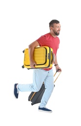 Photo of Man with suitcases running on white background. Vacation travel