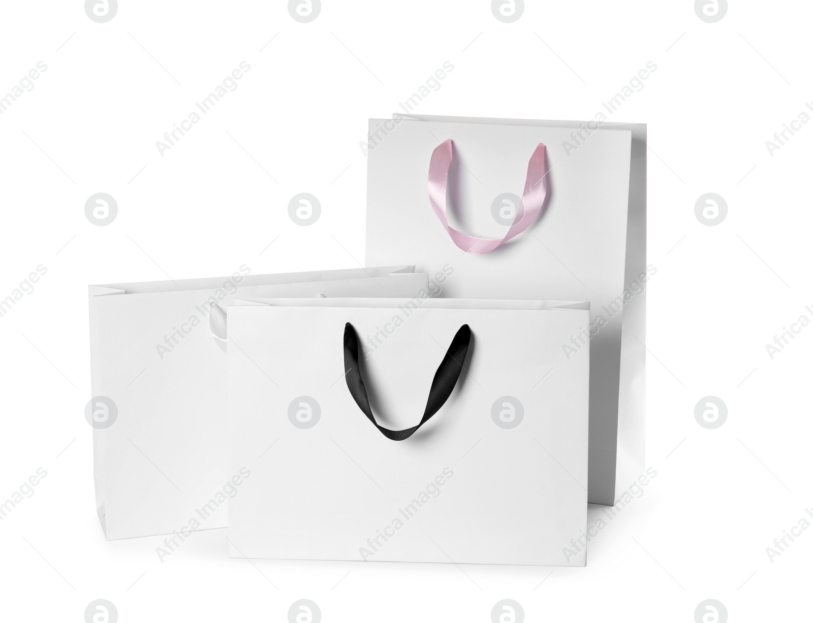 Photo of Paper shopping bags isolated on white. Mock up for design