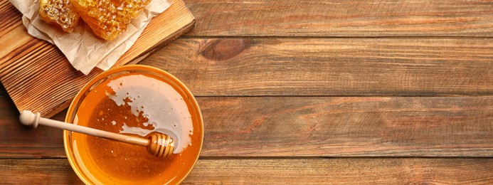 Image of Fresh honey on wooden table, flat lay with space for text. Banner design