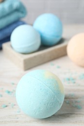 Beautiful aromatic bath bomb on wooden table, closeup