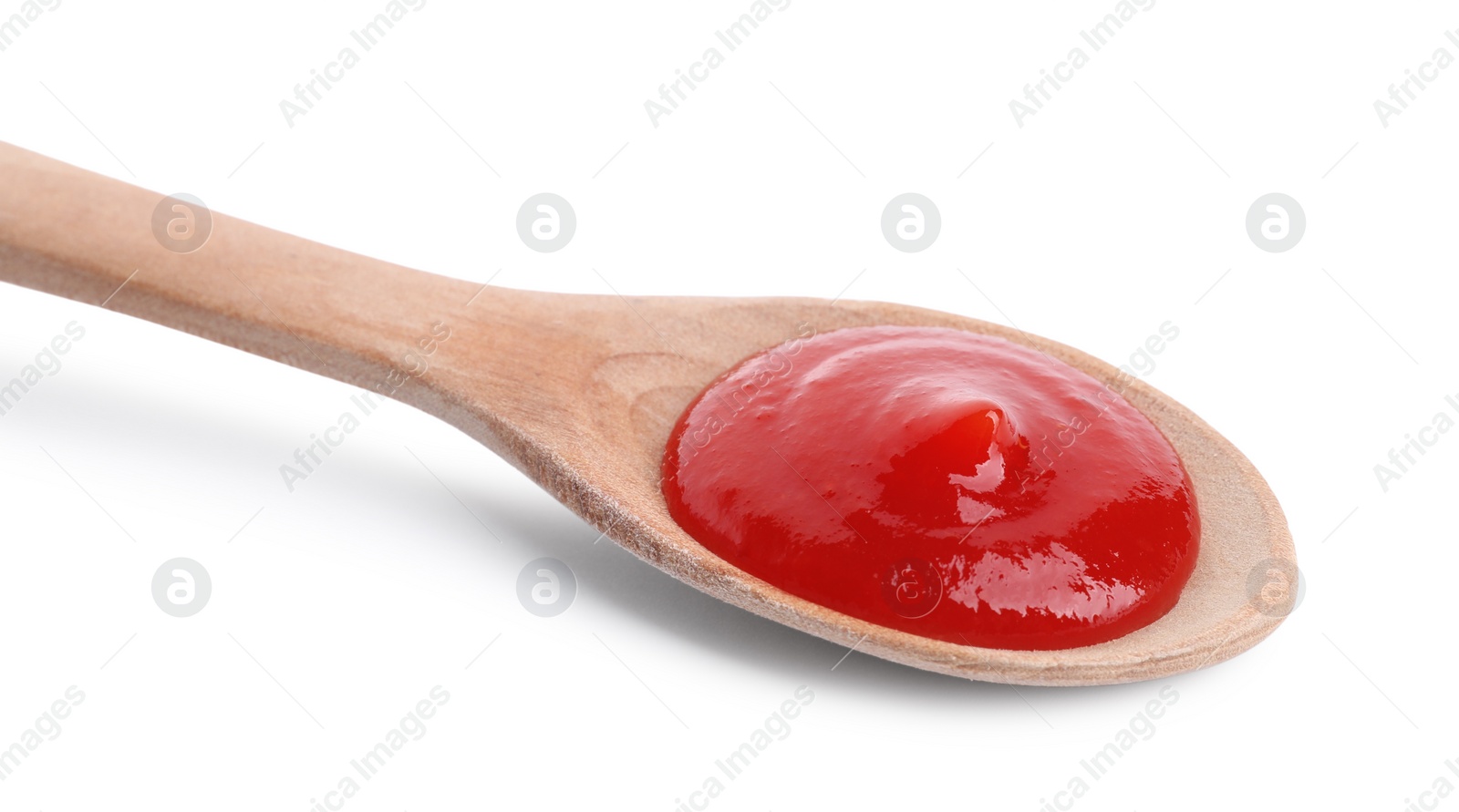 Photo of Spoon with tasty ketchup isolated on white. Tomato sauce