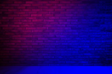 Image of Room with brick wall and wooden floor in neon lights