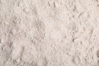 Photo of Pile of oat flour as background, top view