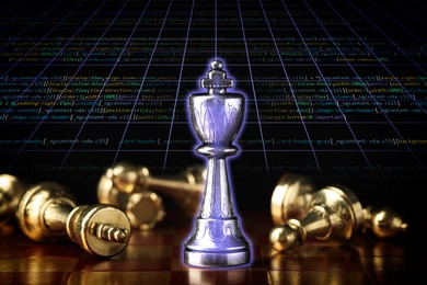 Chess piece among fallen ones on board against programming code