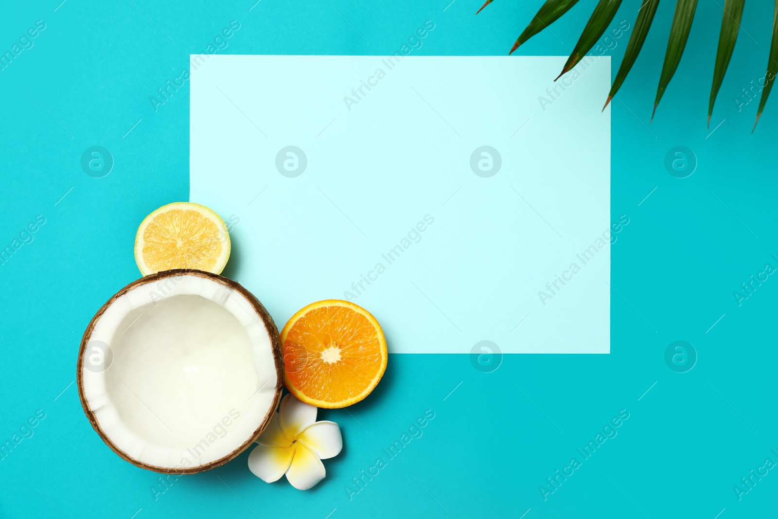 Photo of Flat lay composition with fresh coconut half on blue background. Space for text