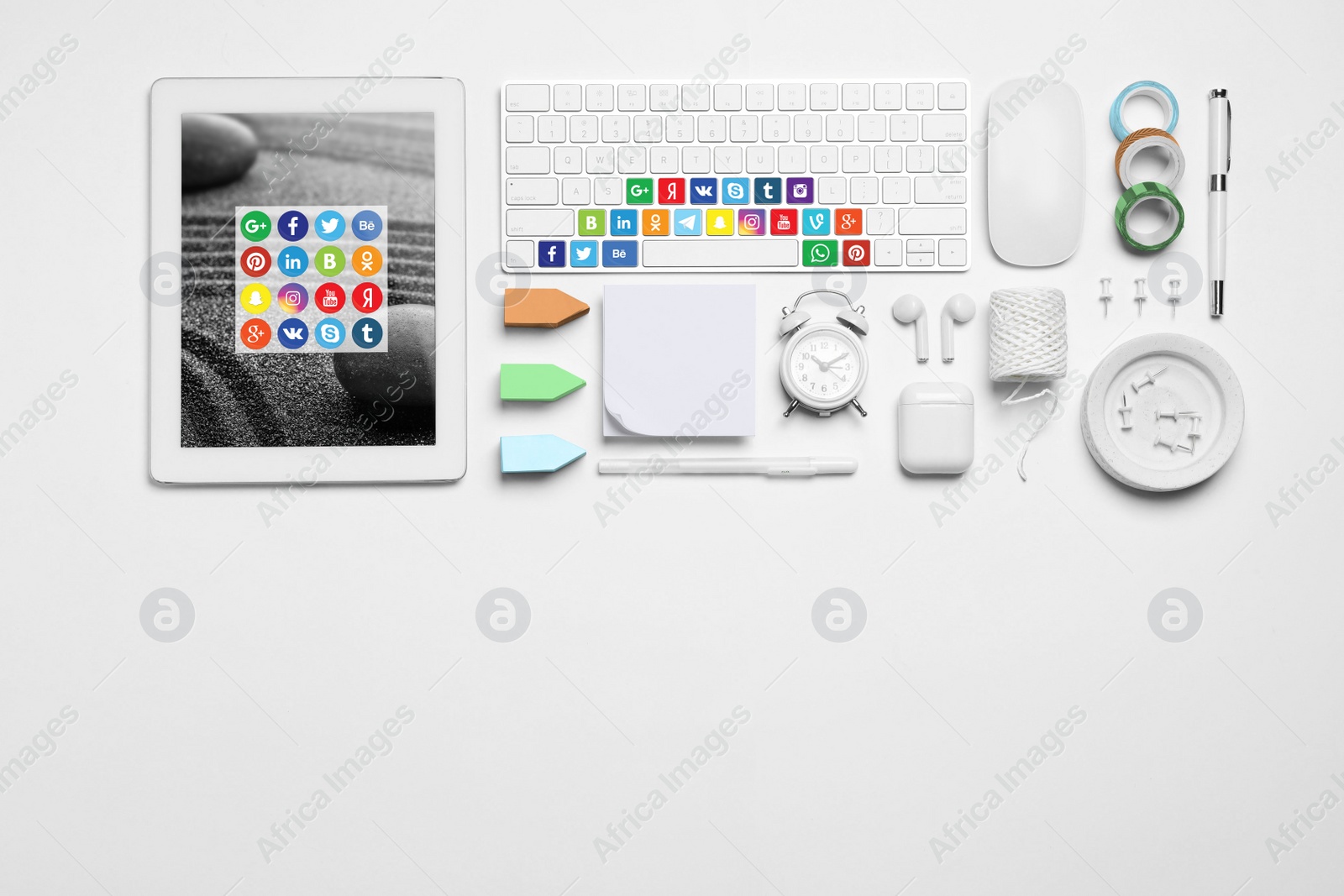 Image of MYKOLAIV, UKRAINE - APRIL 30, 2020: Computer keyboard and tablet with social media apps logotypes on white table, flat lay