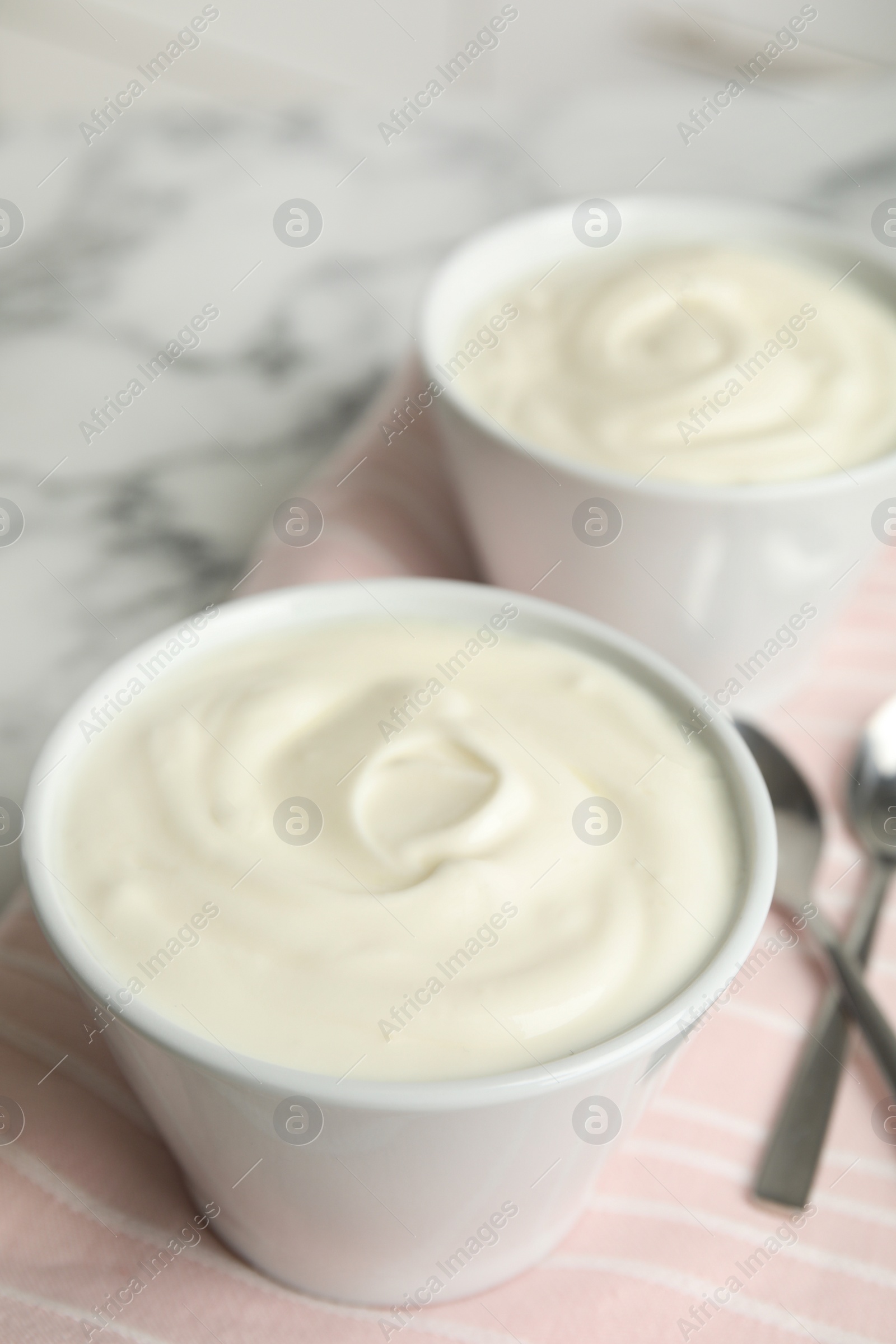 Photo of Tasty organic yogurt on table. Space for text