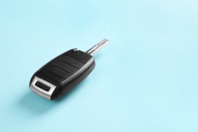 Car key on color background. Space for text