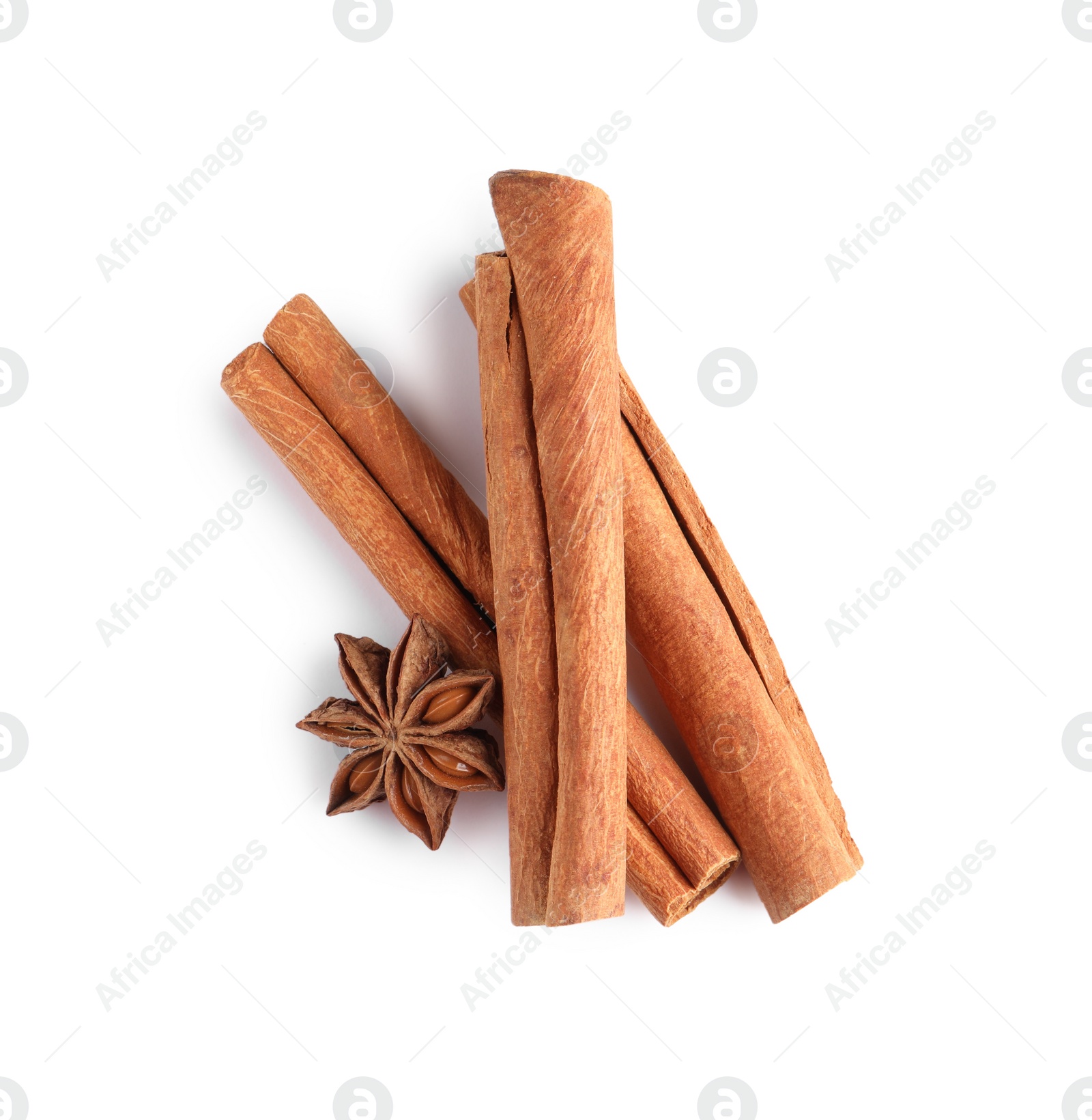 Photo of Cinnamon sticks and anise star isolated on white, top view