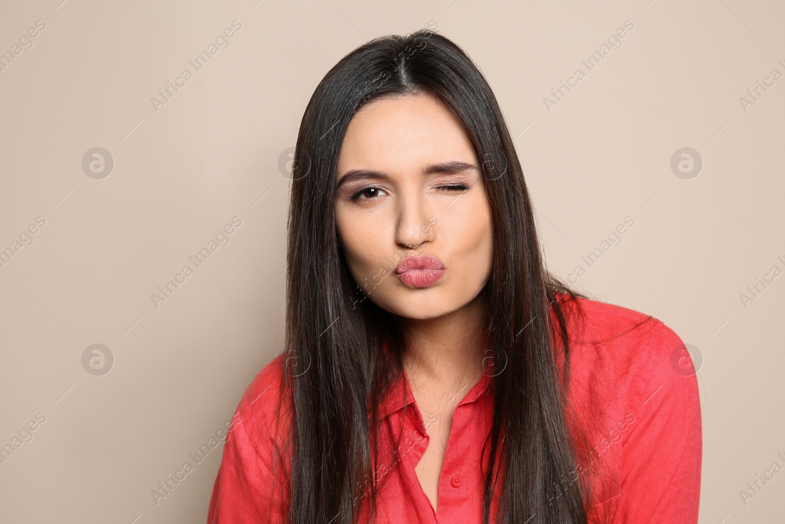 Photo of Portrait of beautiful young woman in stylish clothes on color background