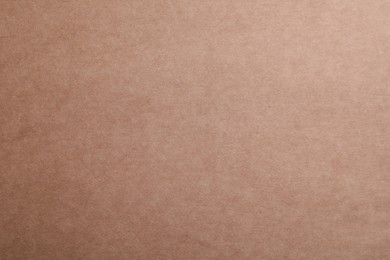 Photo of Texture of kraft paper bag as background, closeup