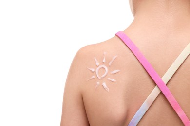 Girl with sun protection cream on her back against white background, closeup