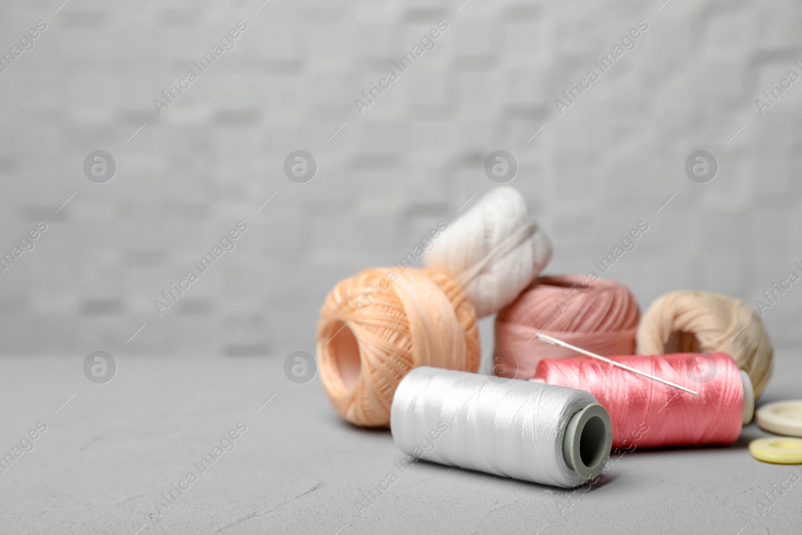 Photo of Color sewing threads on table