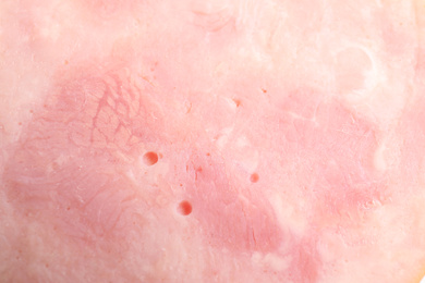Photo of Tasty ham as background, closeup. Fresh delicacy