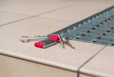 Photo of Keys on tiled staircase outdoors. Lost and found