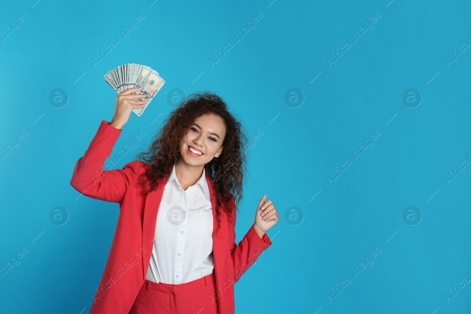 Photo of African-American businesswoman with money on color background. Space for text