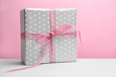 Photo of Elegant gift box for Mother's Day on table