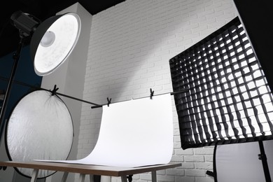 Photo of Interior of modern photo studio with professional equipment, low angle view