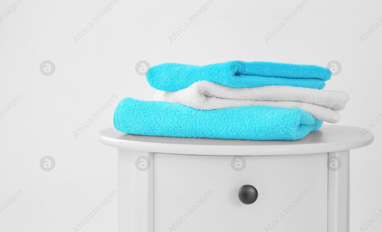 Photo of Stack of clean towels on table