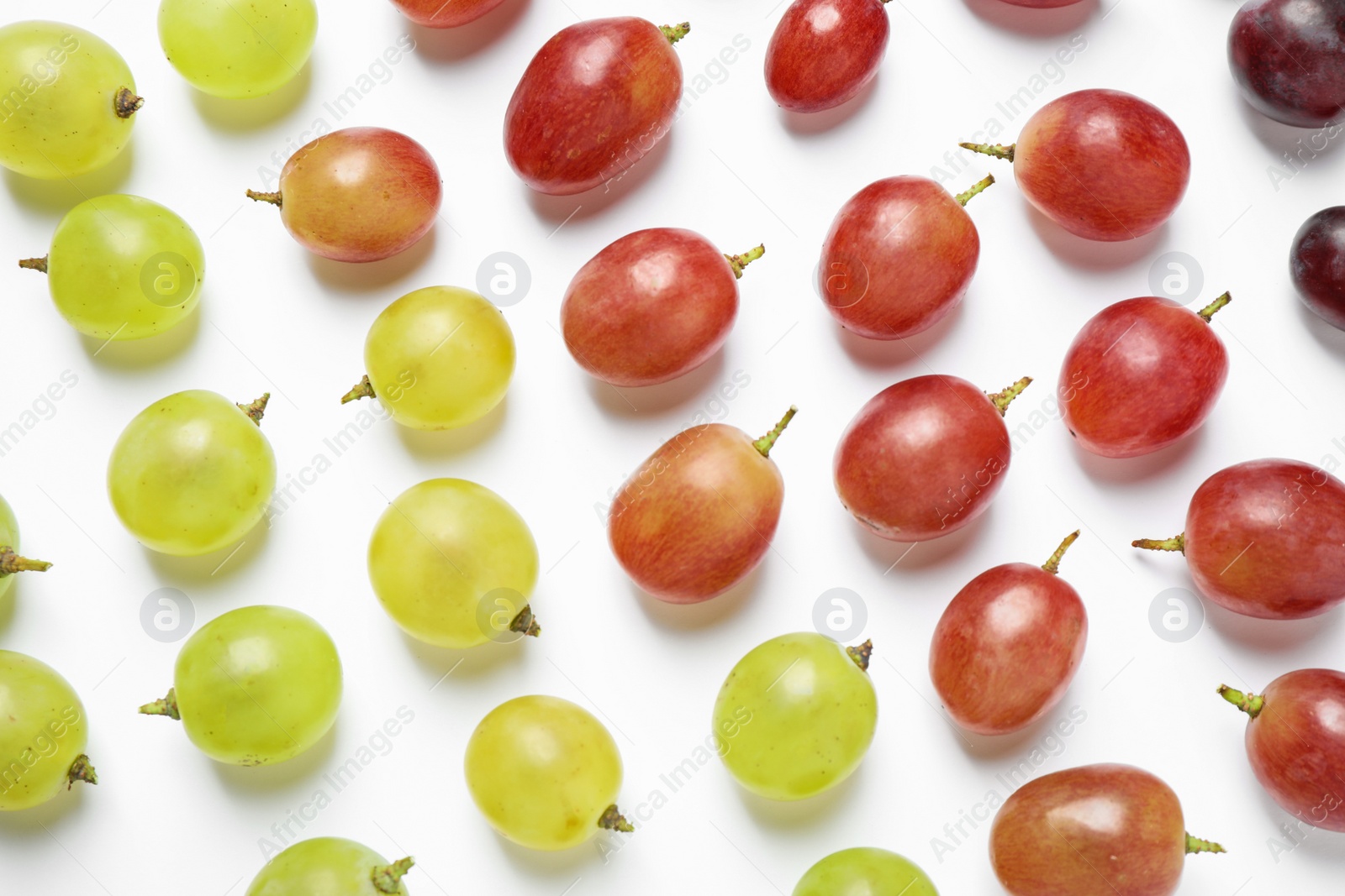 Photo of Fresh ripe juicy grapes on white background, top view