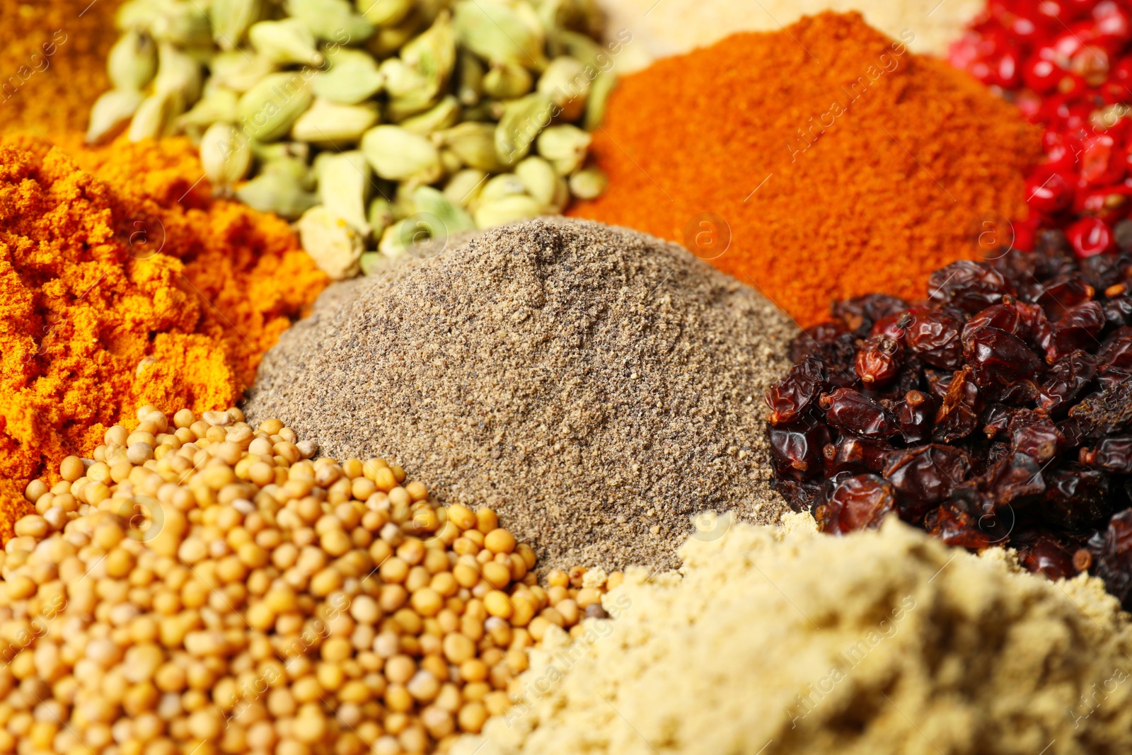 Photo of Many different spices as background, closeup view