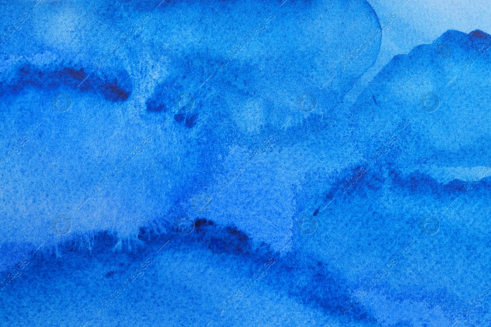 Photo of Abstract blue watercolor painting as background, top view