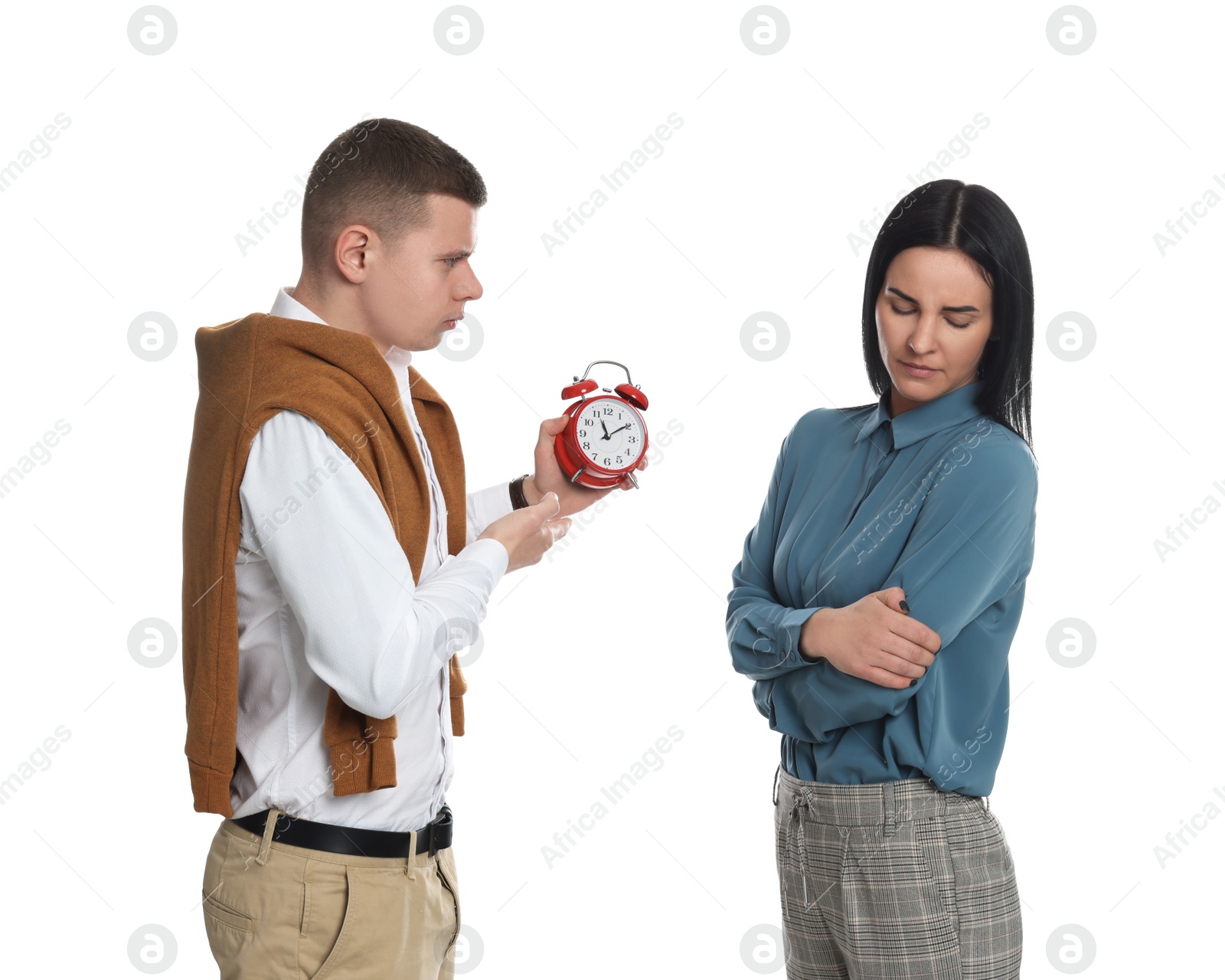 Photo of Businessman with alarm clock scolding employee for being late on white background