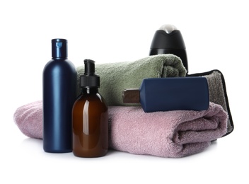 Photo of Personal hygiene products with towels on white background