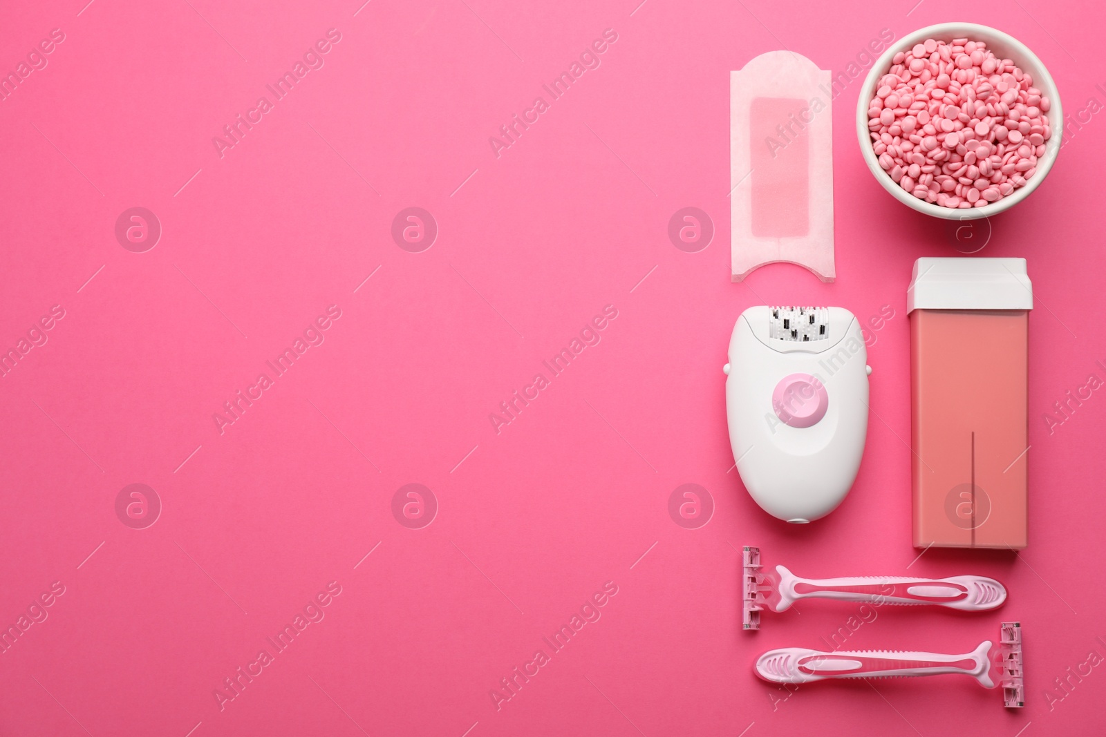 Photo of Set of epilation products on pink background, flat lay. Space for text