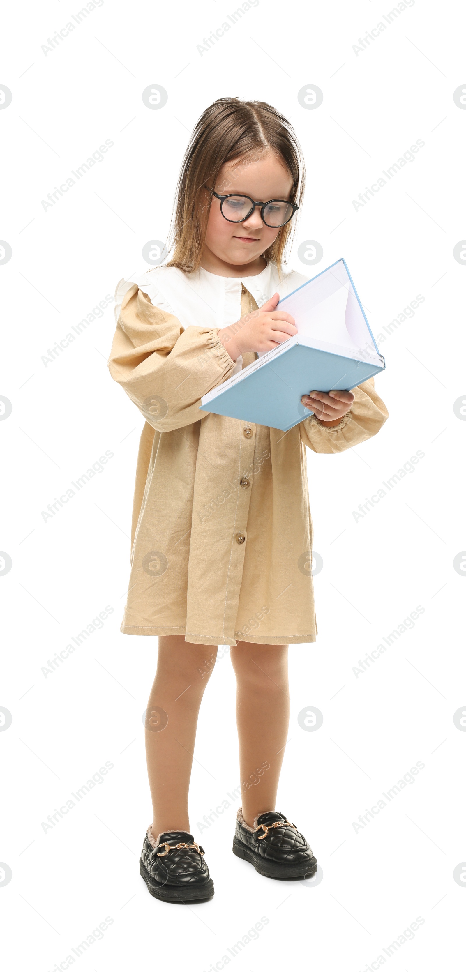 Photo of Cute little girl in glasses reading book on white background