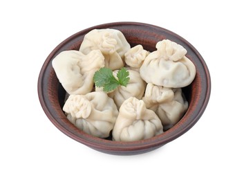 Photo of Many tasty khinkali (dumplings) and parsley in bowl isolated on white. Georgian cuisine