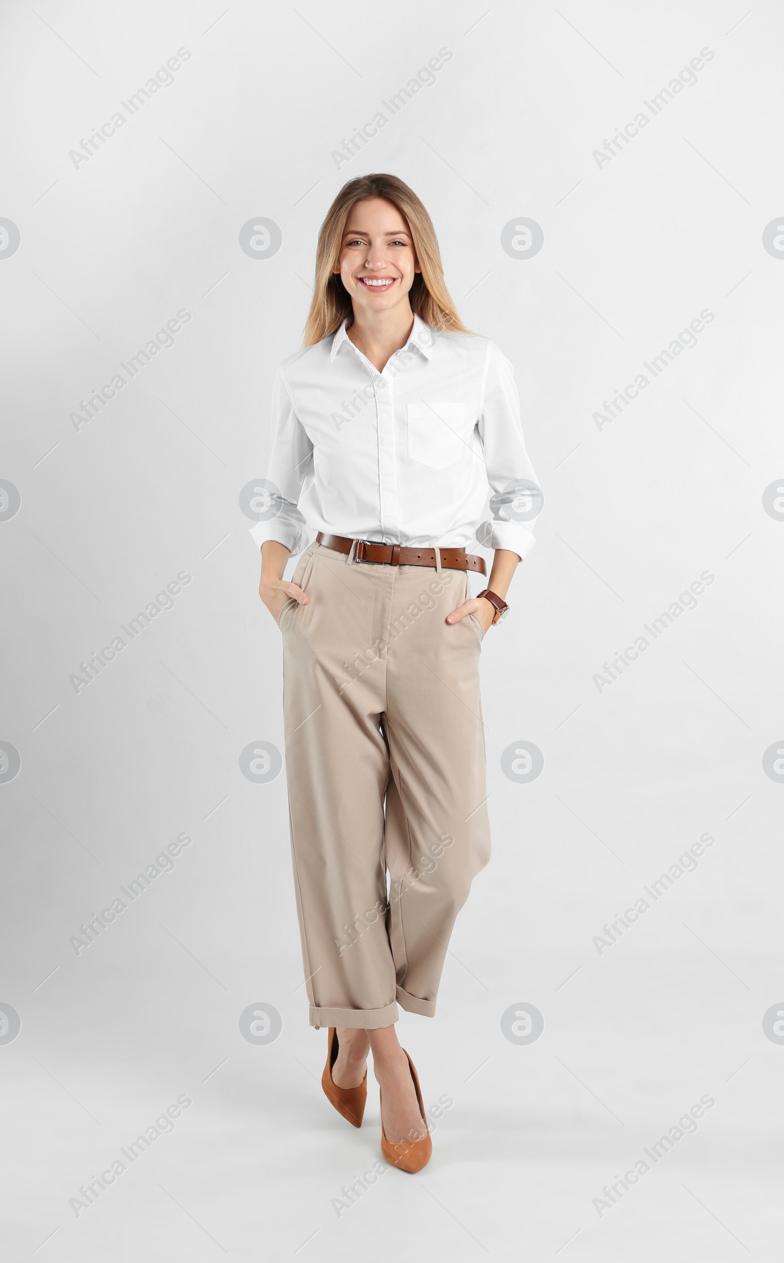 Photo of Full length portrait of beautiful young businesswoman on white background